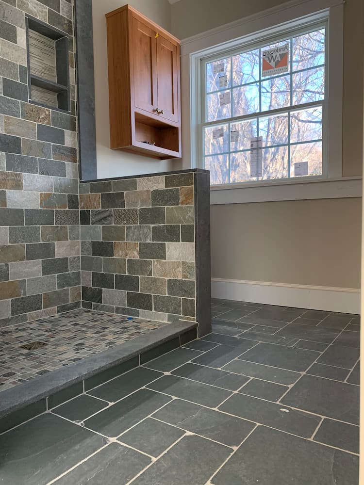 varying color subway tile shower