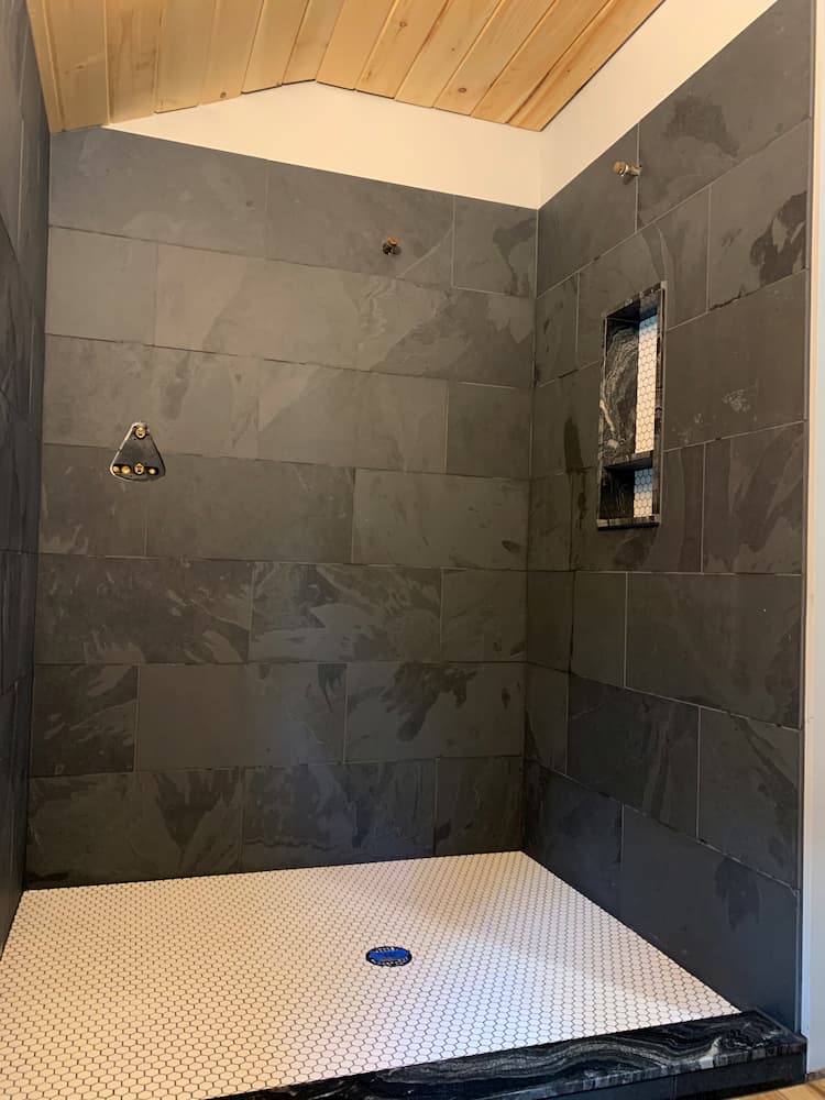slate grey large tile shower with white tile floor