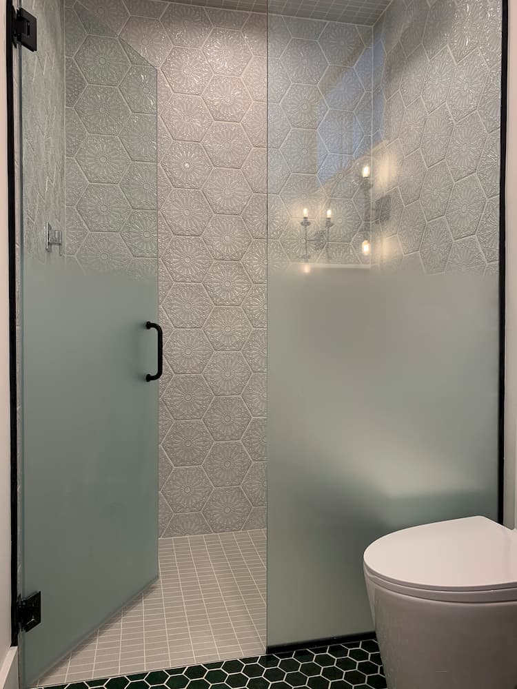 back honeycomb tile floor with shower