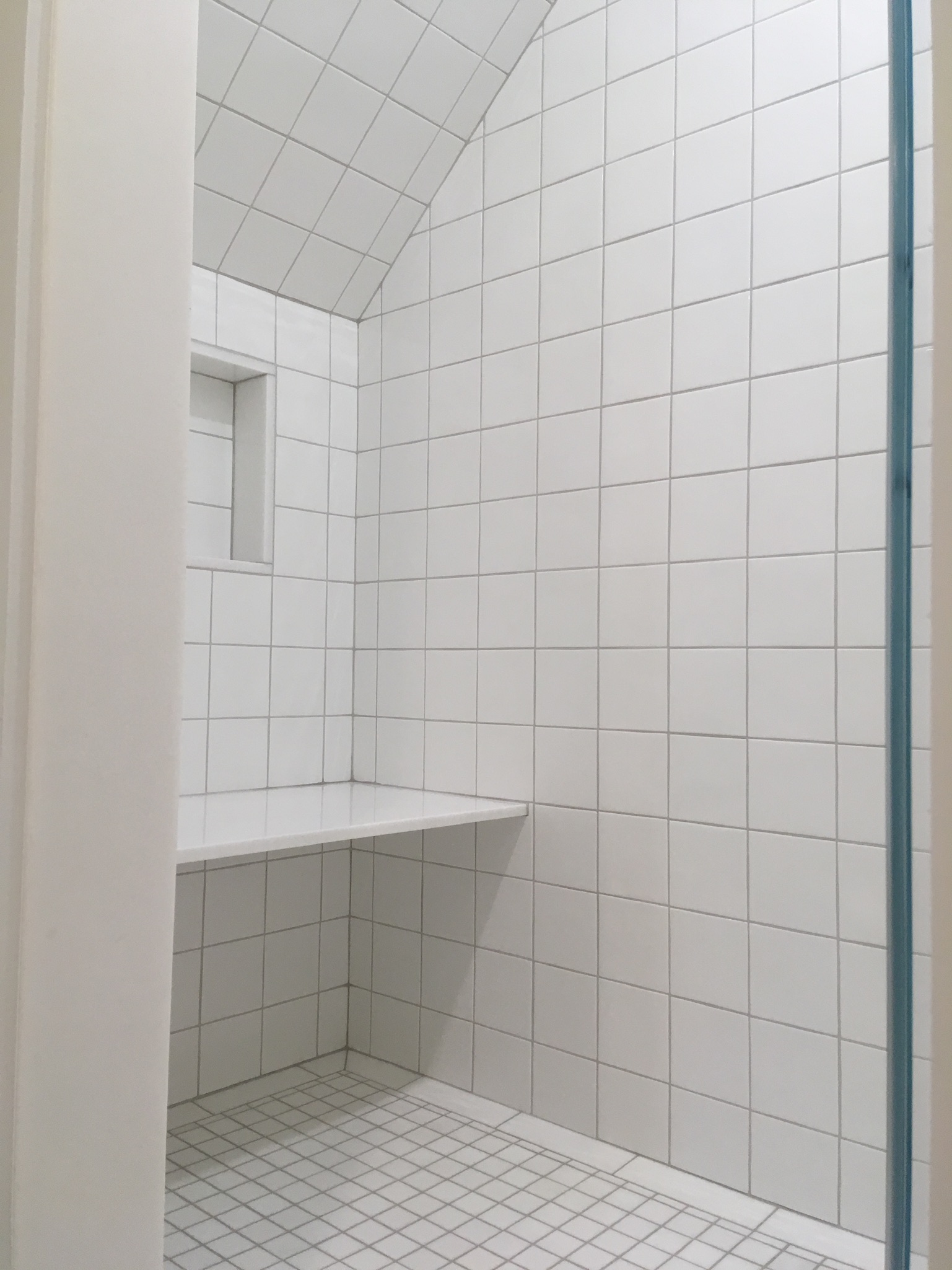 white tile shower