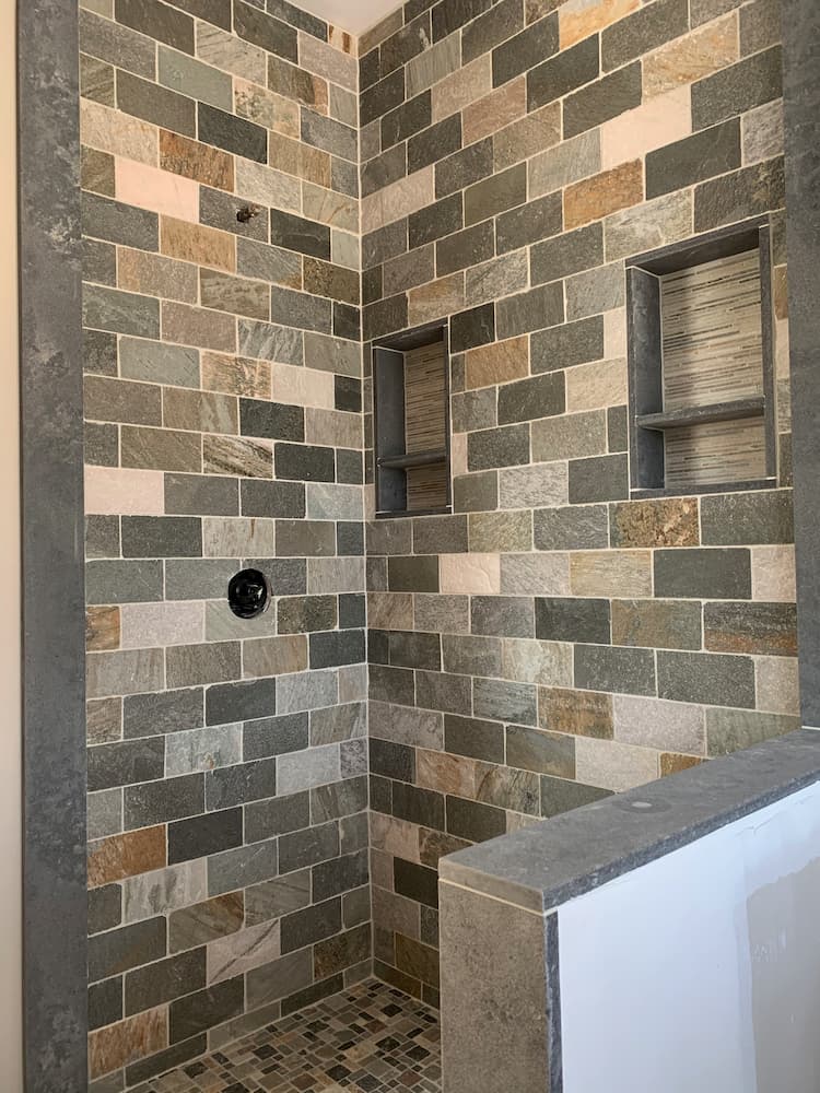 varying color subway tile shower